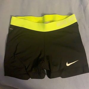 Medium black Nike pro shorts with lime green